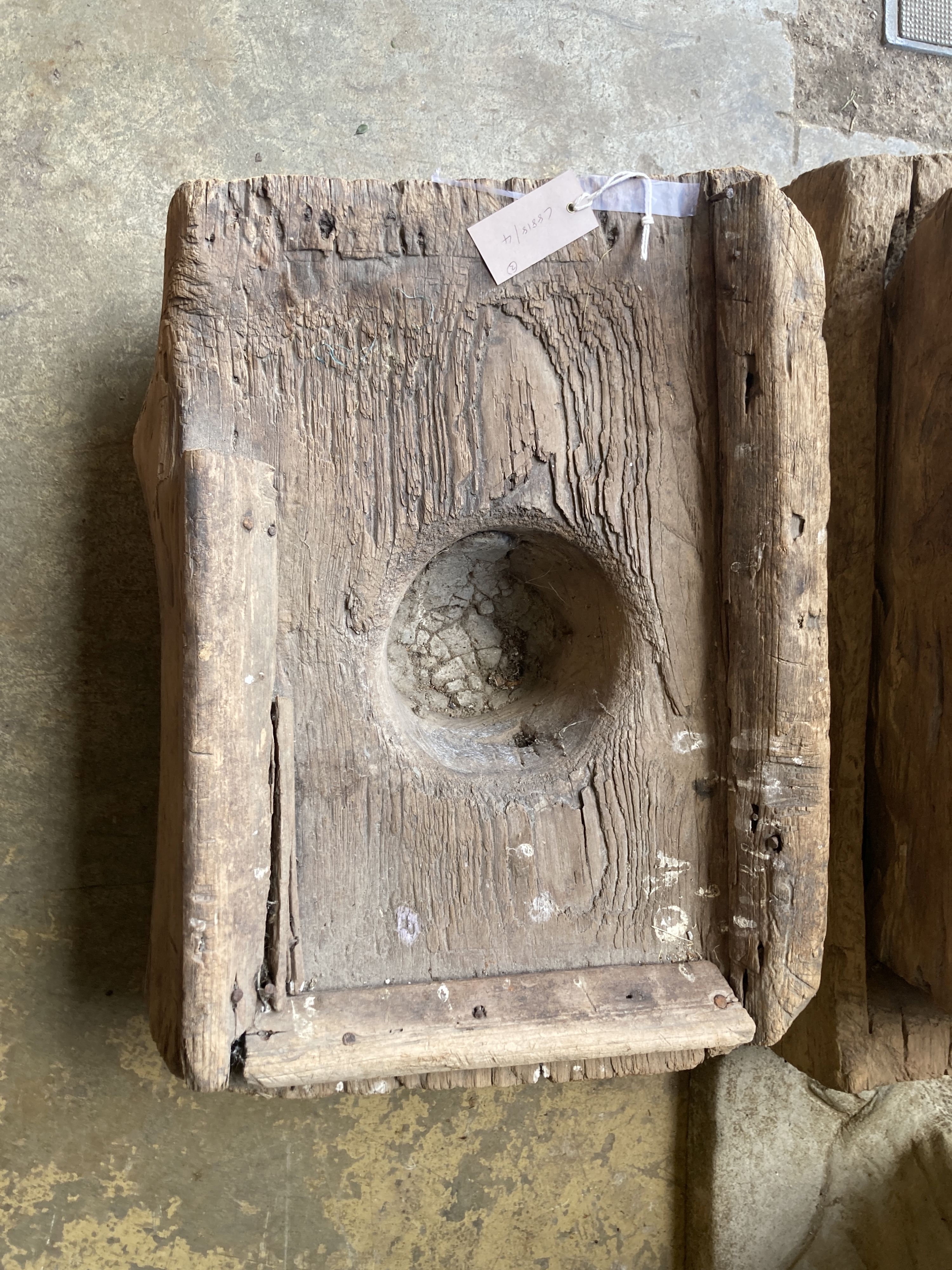 Three Indonesian hardwood rice mortars, largest 60cm, depth 38cm, height 23cm